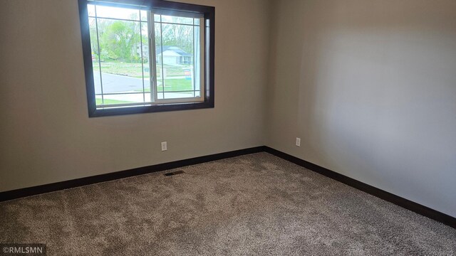 view of carpeted spare room