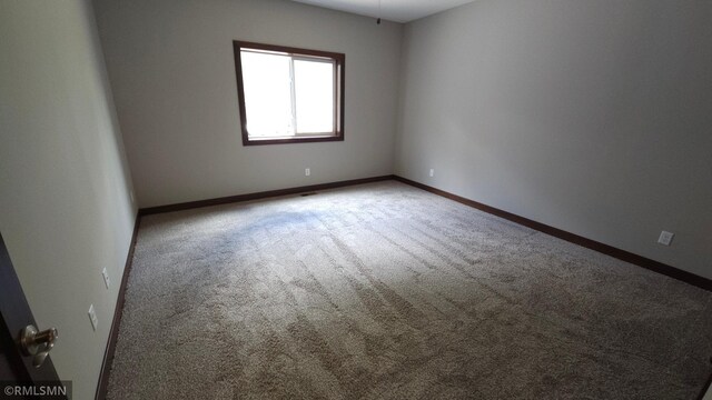 unfurnished room featuring carpet flooring