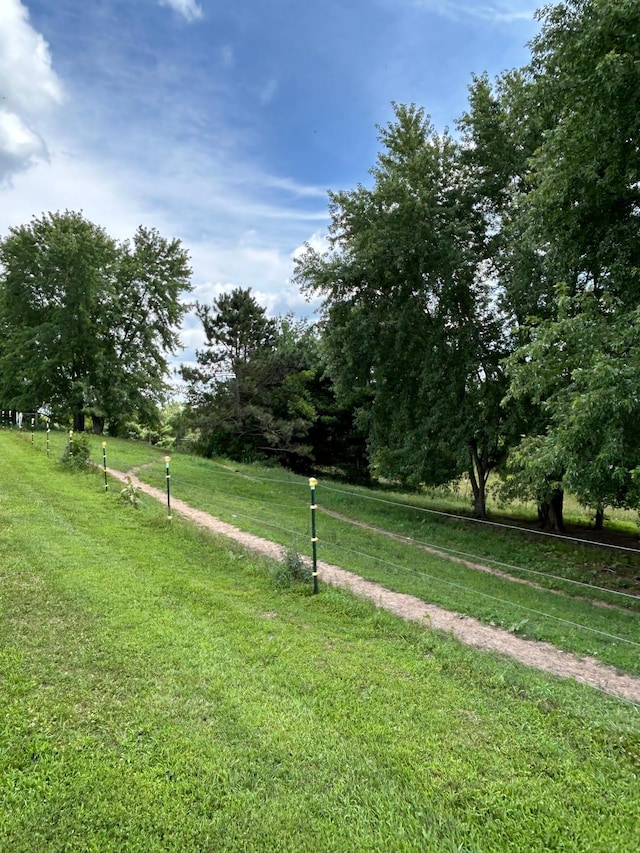 view of yard with a rural view