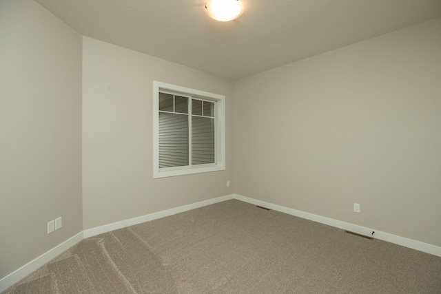 empty room featuring carpet