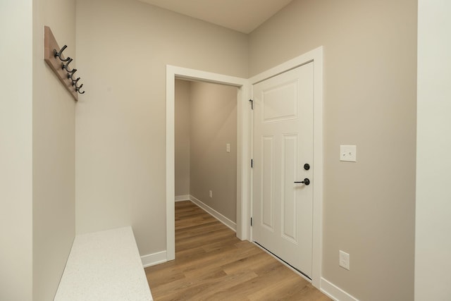 corridor with light wood-type flooring