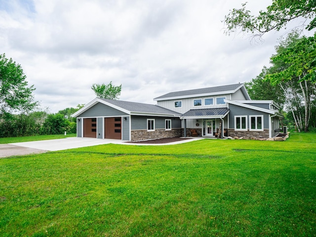 view of front of house featuring a front yard and a garage