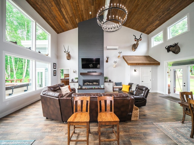 living room with a fireplace, plenty of natural light, and high vaulted ceiling