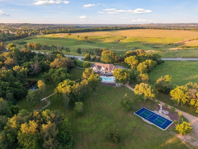 birds eye view of property with a rural view