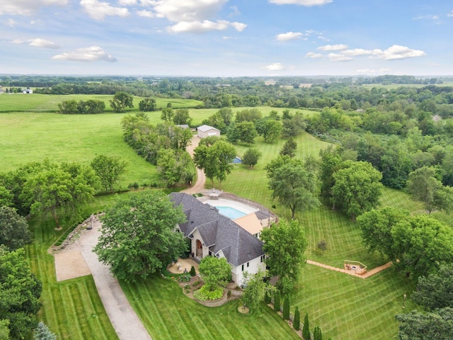 birds eye view of property with a rural view