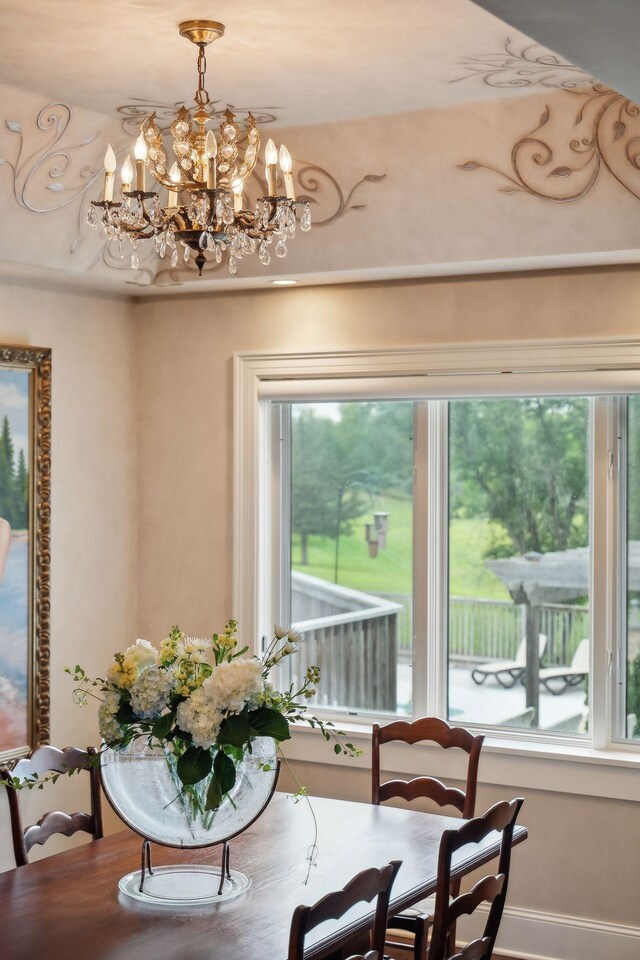 dining space with a notable chandelier