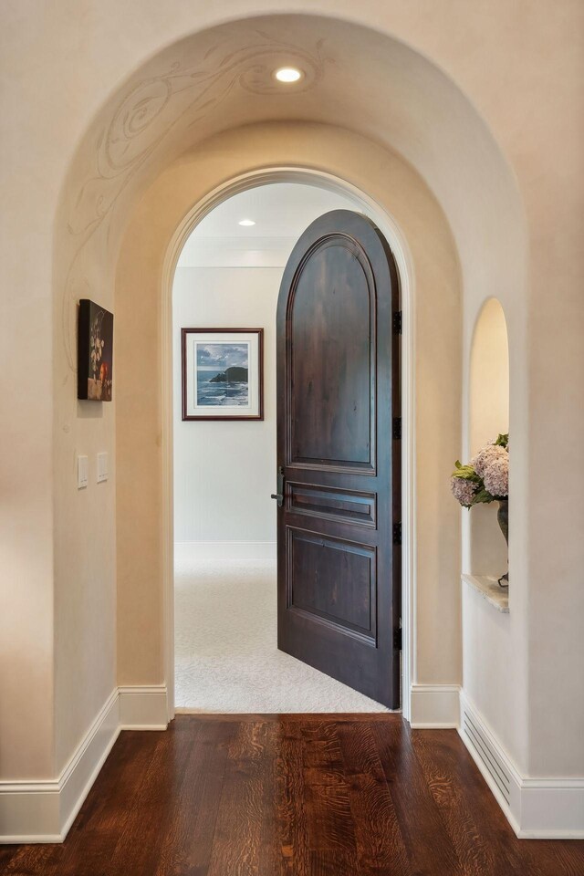 corridor with wood-type flooring