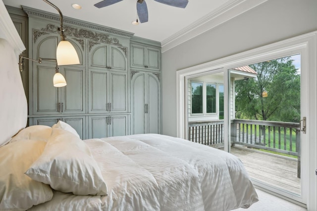 bedroom featuring ceiling fan, ornamental molding, multiple windows, and access to exterior