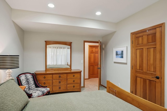 bedroom with light colored carpet