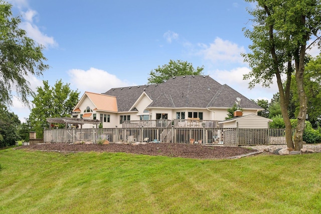 back of property with a yard, a pergola, and a wooden deck