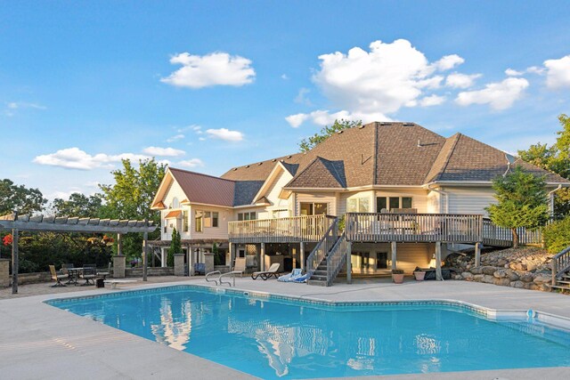 view of pool featuring a deck, a pergola, and a patio