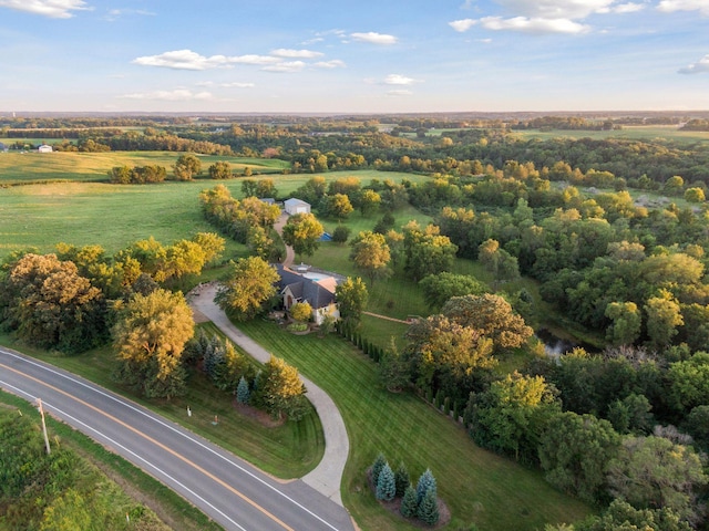 birds eye view of property with a rural view