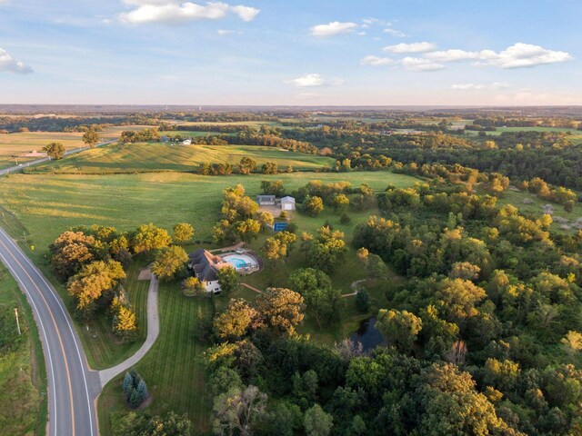 birds eye view of property with a rural view