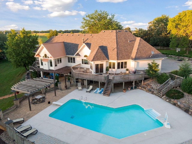 view of swimming pool with a pergola, a deck, a diving board, and a patio area