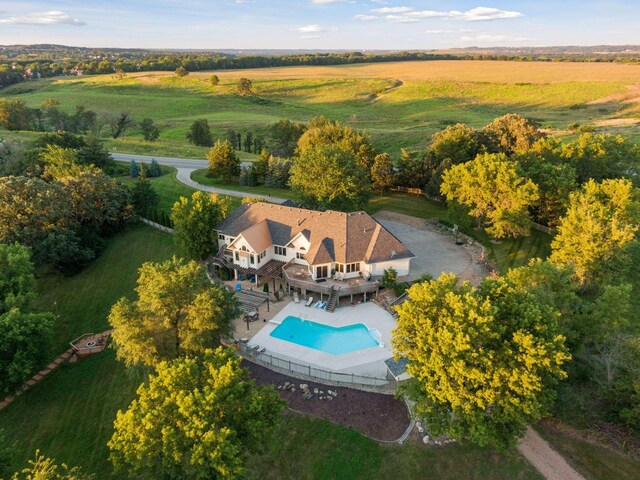 birds eye view of property with a rural view