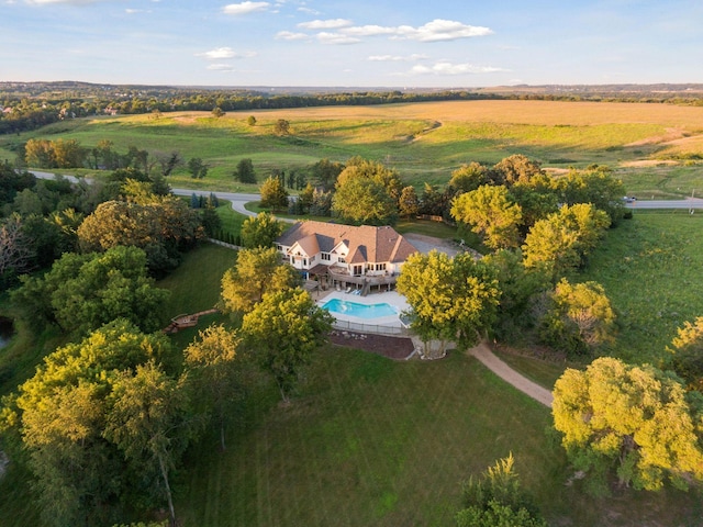 birds eye view of property with a rural view