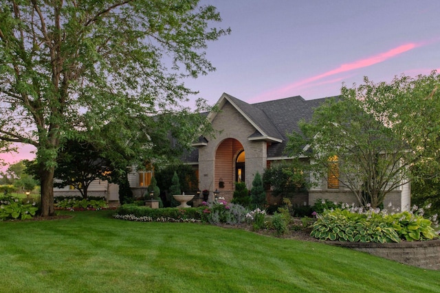 view of front of home with a yard