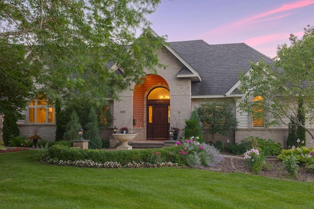 view of front of home featuring a yard