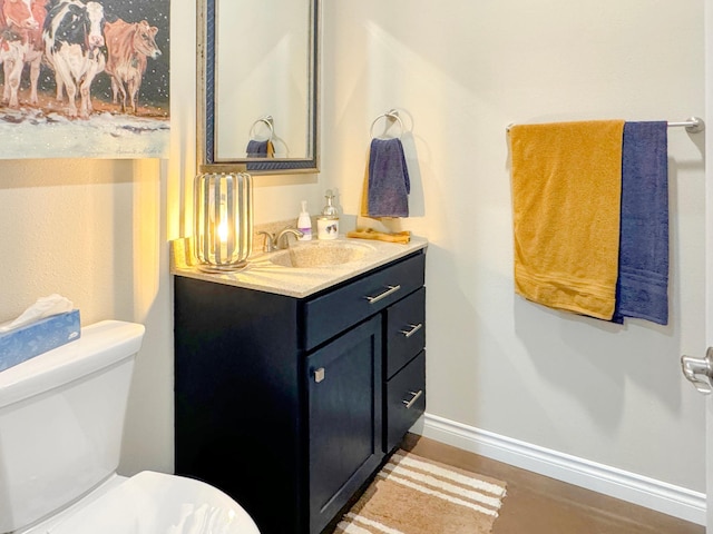 109 Kelsey Ln, Slayton, MN 56172 - bathroom featuring toilet, vanity, and baseboards