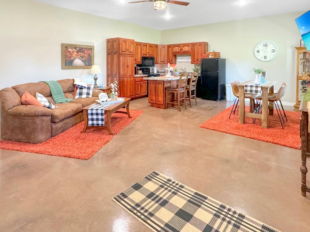 109 Kelsey Ln, Slayton, MN 56172 - living area with concrete flooring and ceiling fan