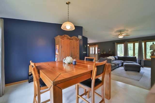 dining space with ceiling fan