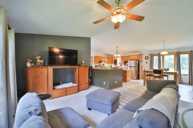 living room featuring ceiling fan, lofted ceiling, and light carpet