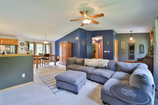 carpeted living room with vaulted ceiling and ceiling fan