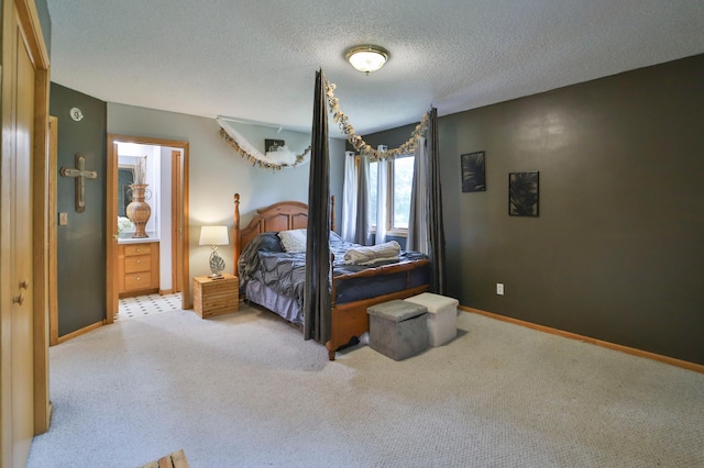 bedroom featuring light carpet and a textured ceiling