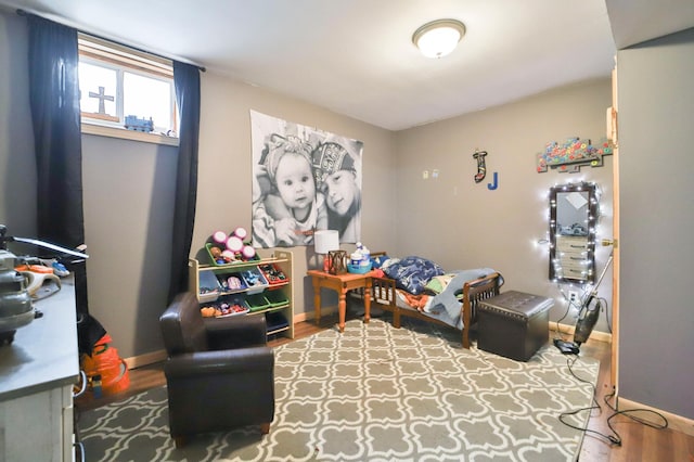 bedroom with hardwood / wood-style flooring