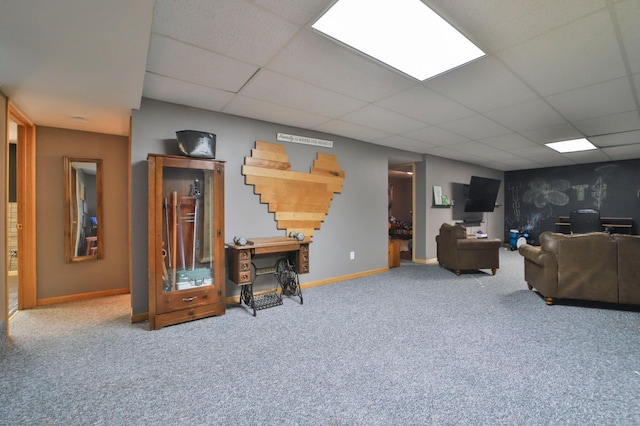 carpeted living room with a drop ceiling