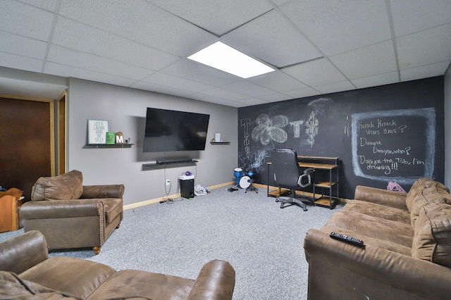 carpeted living room with a paneled ceiling