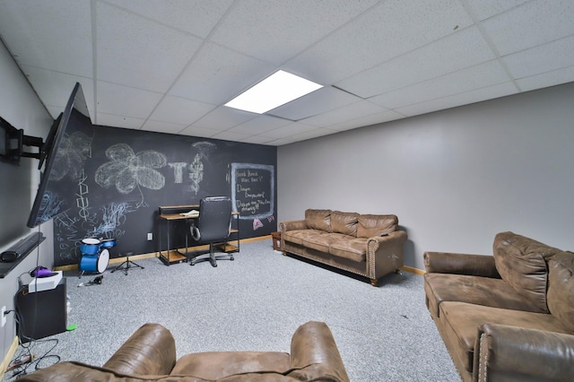 living room with carpet flooring and a drop ceiling