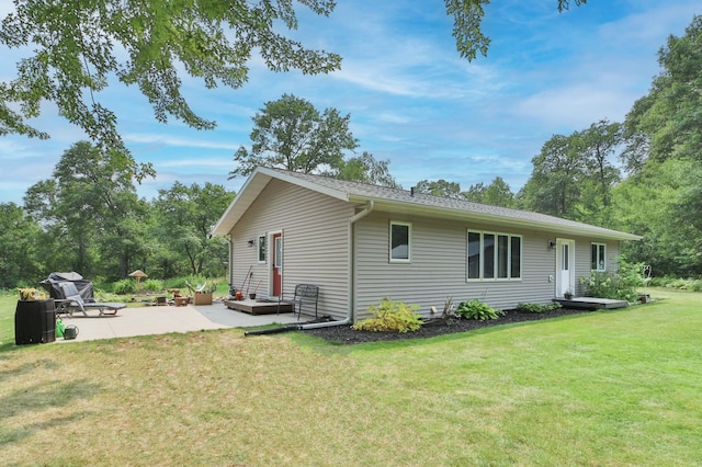 exterior space featuring a lawn and a patio