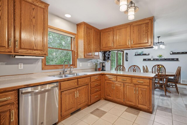 kitchen featuring sink, light tile patterned floors, a chandelier, and stainless steel dishwasher