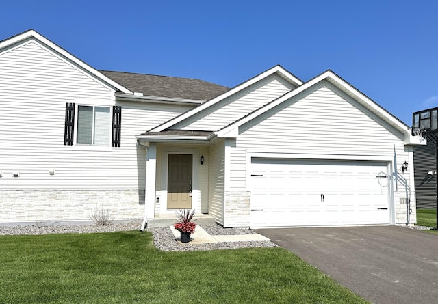 view of front facade with a front lawn and a garage