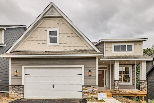 craftsman house with a garage and a porch