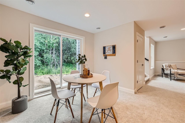 view of carpeted dining space