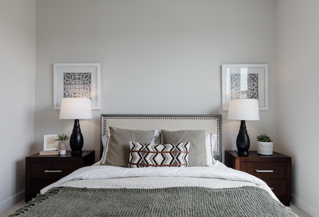 bedroom featuring baseboards and carpet flooring