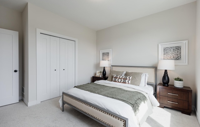 carpeted bedroom with a closet