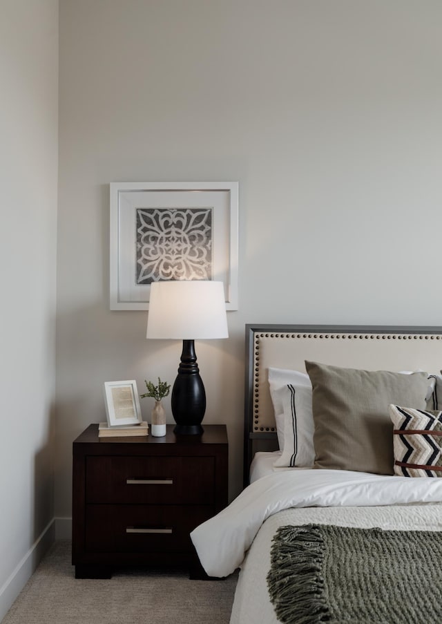 bedroom with carpet floors and baseboards