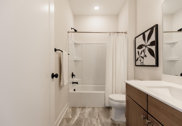 bathroom with vanity, toilet, and shower / bath combo with shower curtain