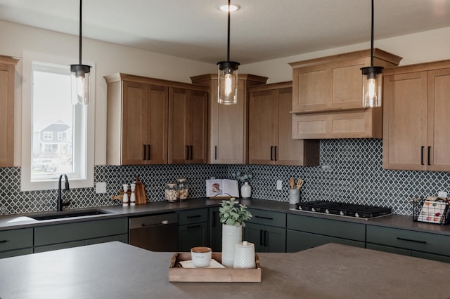 kitchen featuring stainless steel appliances, backsplash, dark countertops, and a sink