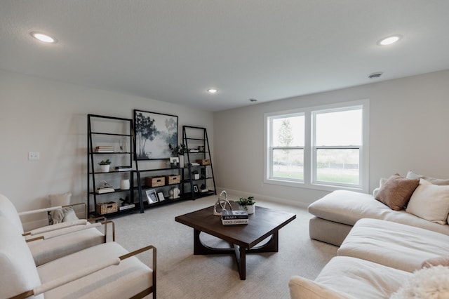 living room with light carpet, baseboards, and recessed lighting