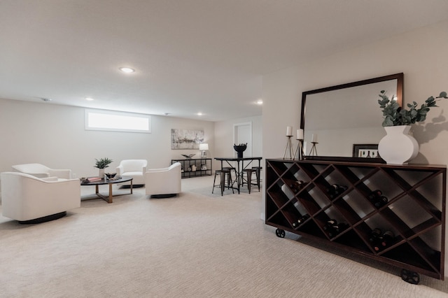 living area featuring recessed lighting and carpet flooring