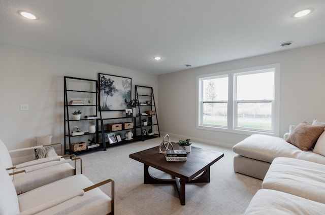 living area with carpet floors and recessed lighting