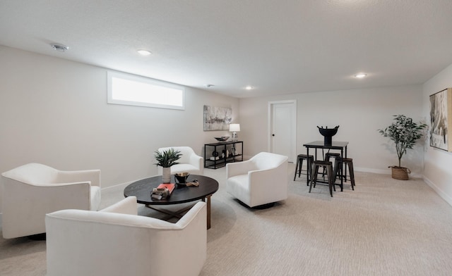 living area featuring light carpet, baseboards, and recessed lighting