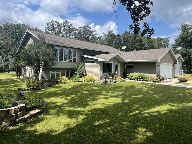 view of front of property with a garage and a front lawn