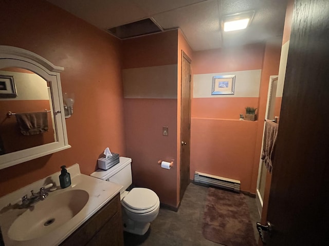 bathroom with vanity, toilet, and a baseboard radiator