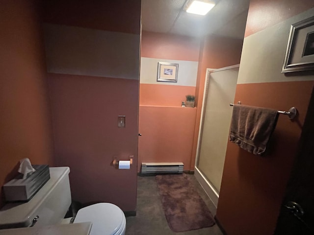 bathroom with toilet, a shower with shower door, and a baseboard heating unit