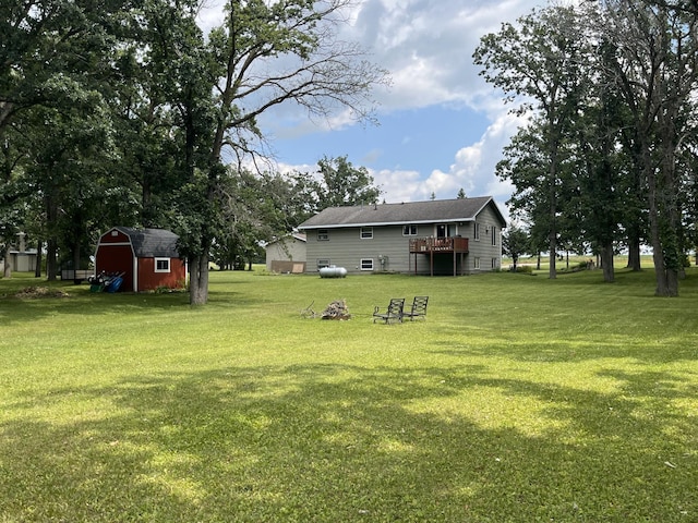 view of yard with a storage unit and a deck